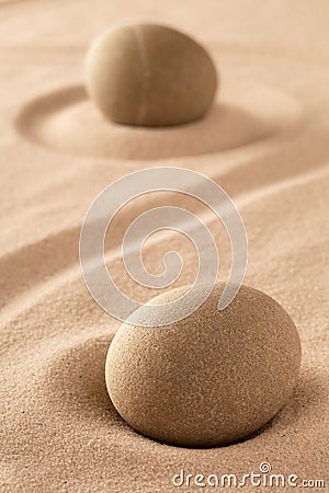 Two round stones in sand Stock Photo