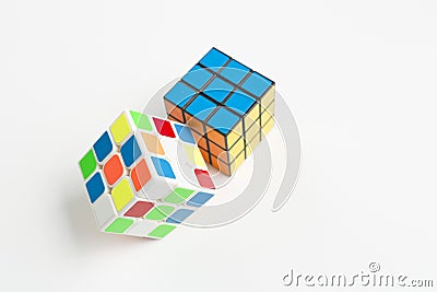 Two rubik cubes on a background of white Editorial Stock Photo