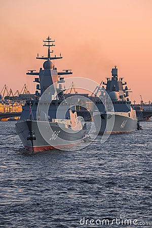 Two Russian warships on the evening Neva. St. Petersburg Editorial Stock Photo