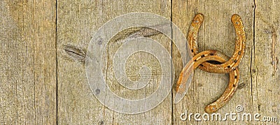 Two rusty and aged horse shoes Stock Photo