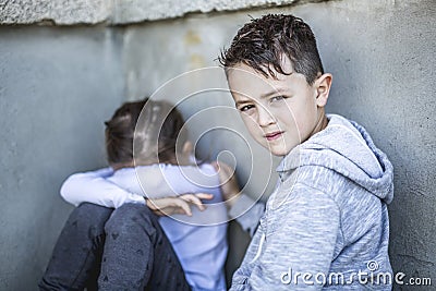 Six years old sad school at the schoolyards Stock Photo