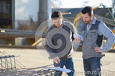 Two safety specialists monitoring perimeter petrochemical refinary Stock Photo