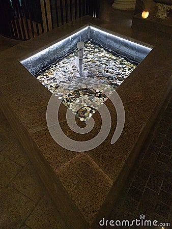 Water fountain with gobble stones of different colors Stock Photo