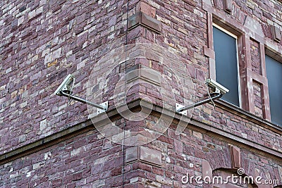 Two Security Cameras on Brick Wall Corner Security Change Architecture Stock Photo