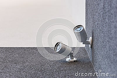 Two security cameras on office building, security system concept Stock Photo