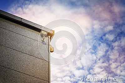 Two Security cameras on the side of an modern building Stock Photo