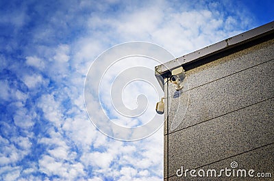 Two Security cameras on the side of an modern building Stock Photo