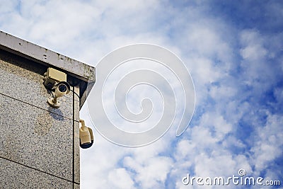 Two Security cameras on the side of an modern building Stock Photo