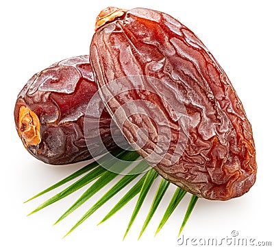 Two semi-dried dates or date palm fruits lie on palm leaves isolated on white background. File contains clipping path Stock Photo