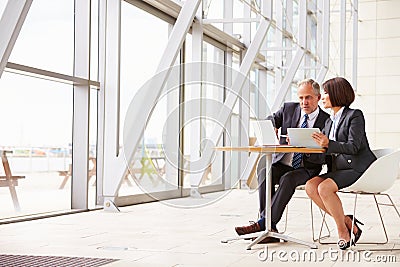 Two senior business colleagues at meeting in modern interior Stock Photo