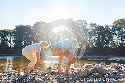 Two senior people enjoying retirement and simplicity while throw Stock Photo