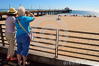 Two senior women gaze out to the Pacific Ocean Editorial Stock Photo