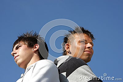 Two serious looking teenagers Stock Photo