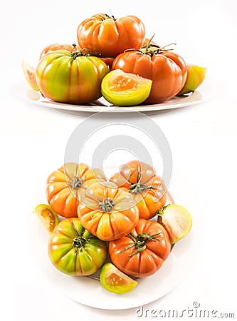 Two sets of compositions of lycopersicum type tomatoes on a white plate Stock Photo