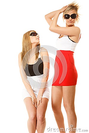 Two crazy women in summer clothes sunglasses. Stock Photo