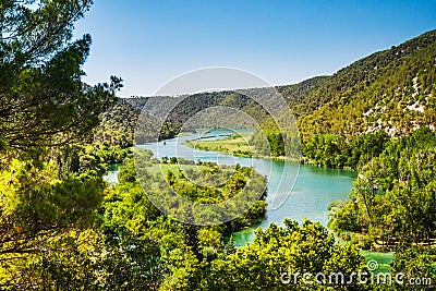 Two ships sail on the river. Around the forest and mountains. Krka, National Park, Dalmatia, Croatia Stock Photo