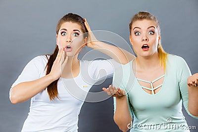 Two shocked and amazed women Stock Photo