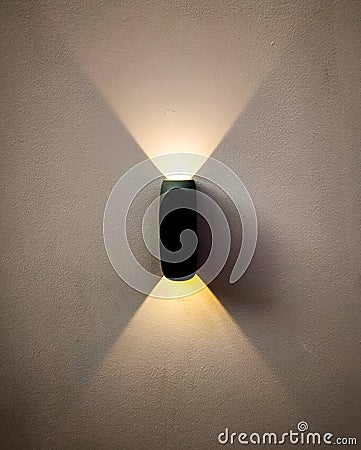 two sided wall light with yellow light Stock Photo