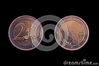 Two sides of the 2 euro coin placed side-by-side on black background Stock Photo