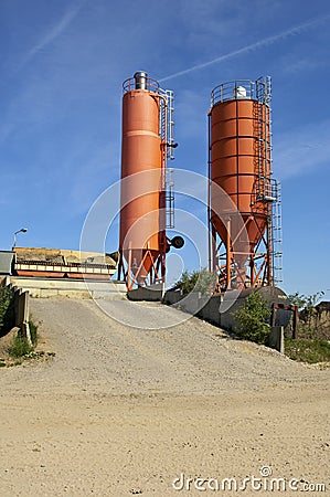 Two silos against sky Stock Photo