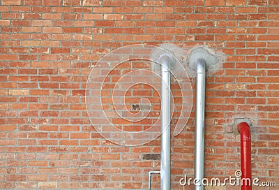 Two silver pipes and red one Stock Photo
