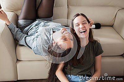 Two sisters having fun at home Stock Photo