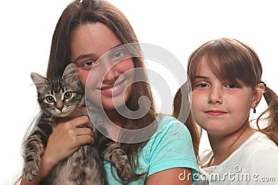 Two Sisters Holding Their Young Kitten Stock Photo