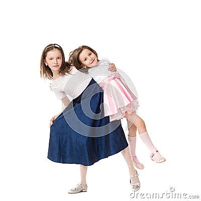 Two sisters in holiday dresses Stock Photo