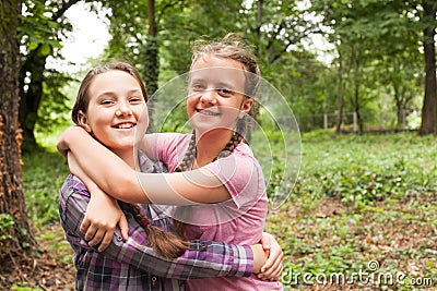 Two sisters hugs Stock Photo