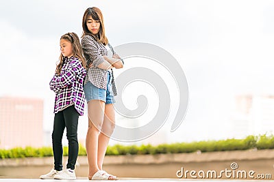 Two sisters mad at each other, family issue or relationship concept, with copy space Stock Photo