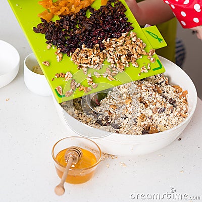 Two sisters preparing granola together Stock Photo