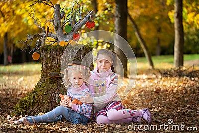 Girls in the autumn park Stock Photo