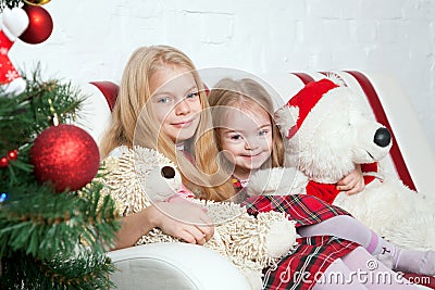 Two sisters with teddy bears. Winter holidays. Stock Photo