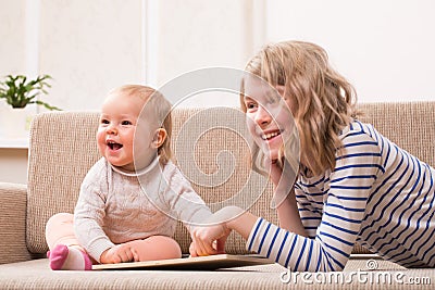 Two sisters watching tablet PC Stock Photo