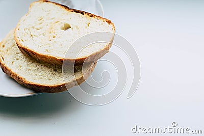 Two slices of white bread on a plate Stock Photo