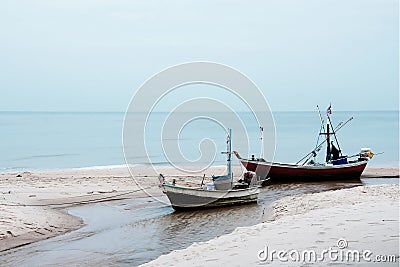 Two small fishing boats wait out for fishing at nighttime. Stock Photo