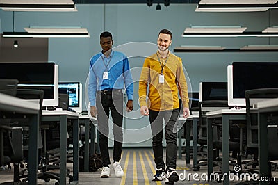 Two smiling male managers in IT office Stock Photo