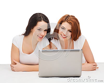 Two smiling teenage girsl with laptop computer Stock Photo