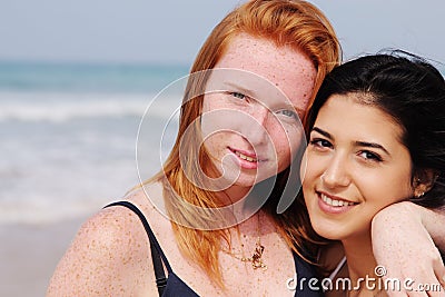 Two smiling young teenage girlfriends Stock Photo