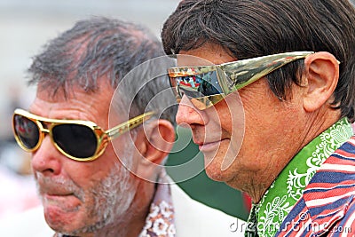 Two snazzy men at the Feast of St George in Trafalgar Square. An annual banquet for St George`s Day Editorial Stock Photo