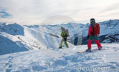 Two snowboarders on the mountain top Stock Photo