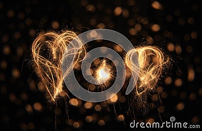 Two sparkler hearts at night Stock Photo