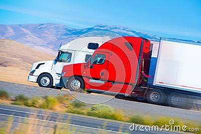 Two Speeding Semi Trucks Stock Photo