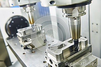 Two spindel CNC milling machine at simultaneous metal working Stock Photo