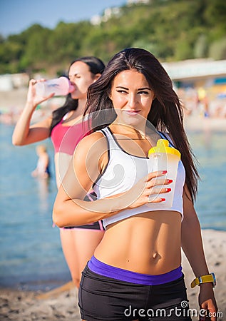 Two sports girls on a beach Stock Photo