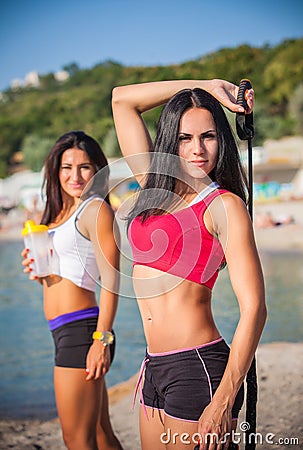 Two sports girls on a beach Stock Photo