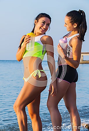 Two sports girls on a beach Stock Photo