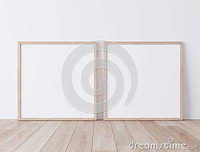 Two square wooden frame mock up. Two mock up poster standing on wooden floor Stock Photo