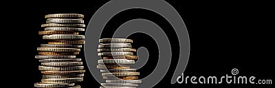 Two stacks of coins of different heights on a black background. AI Generated Stock Photo