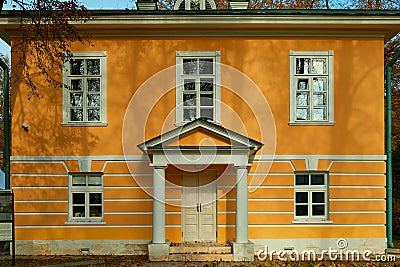 A two storied orange outhouse with white stucco moldings in Museum-Estate Arkhangelskoye Editorial Stock Photo